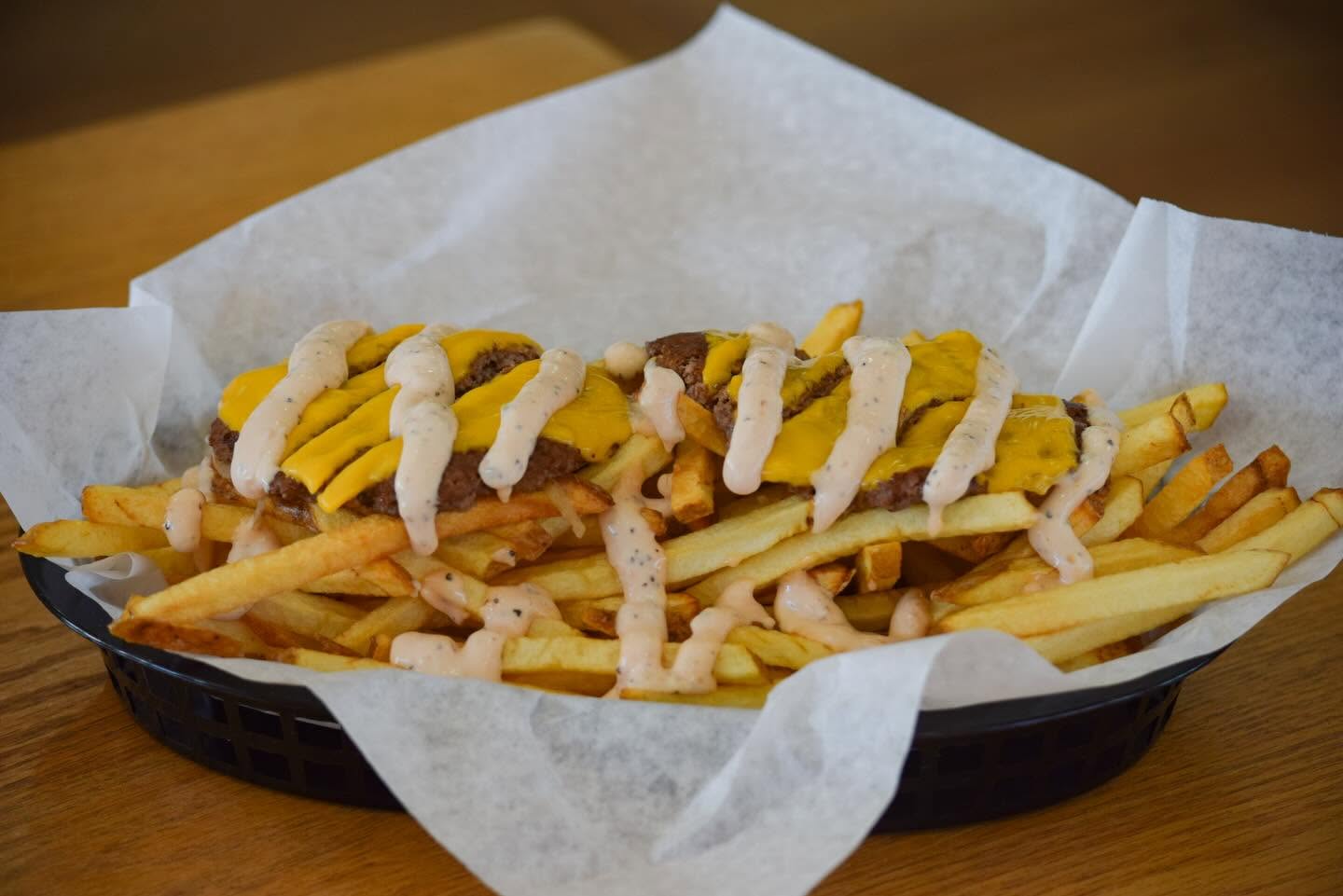Loaded fries with cheese and sauce